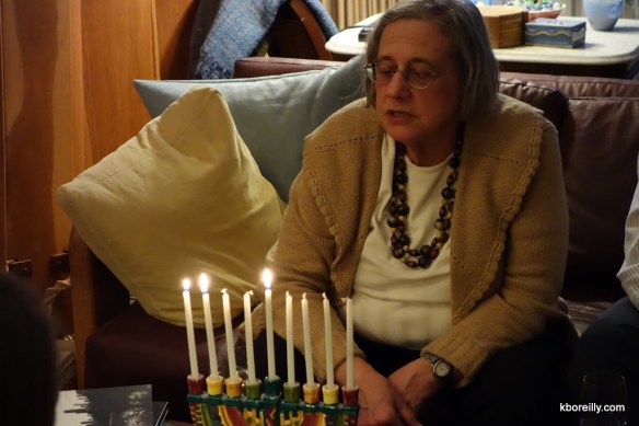 The Stris lights the menorah on Thanksgivukkah.